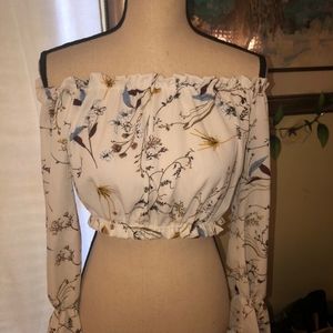 Beautiful top never worn. White floral and ties up the back.